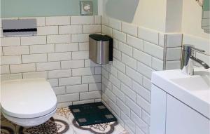 a bathroom with a toilet and a sink at Beautiful Apartment In Mettmann With Wifi in Mettmann