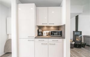 Kuchyň nebo kuchyňský kout v ubytování Baltic Village-Damp