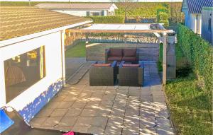 a patio with a couch in a backyard at Calimero in Sint Annaland +20 photos