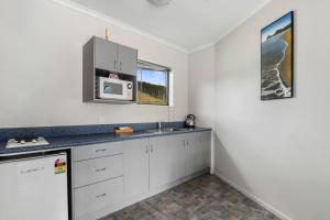 A kitchen or kitchenette at Linkwater 12 - Marlborough Sounds Holiday Unit