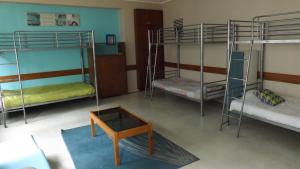 A bunk bed or bunk beds in a room at City Drops Hostel