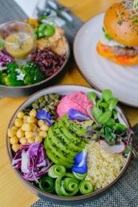 a plate of food with different types of food on a table at Roost Glamping - SHA Certified in Rawai Beach