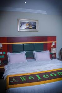 Ένα ή περισσότερα κρεβάτια σε δωμάτιο στο Best Lodge