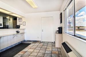 a kitchen with a counter and a window at Motel 6-Santa Rosa, NM in Santa Rosa