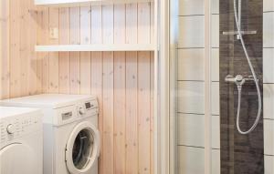 a washing machine in a bathroom with a shower at Lovely Home In Sjusjen With Wifi in Sjusjøen