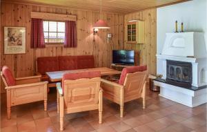 a dining room with a table and a fireplace at Bjertnes Turistgrd in Noresund