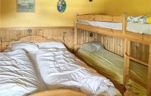 a bedroom with two bunk beds in it at 4 Bedroom Amazing Home In Kristiansand in Vennesla