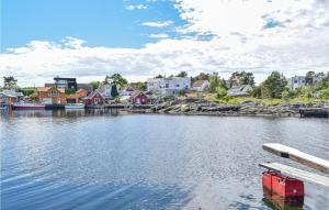 a view of a body of water with houses at Lovely Home In Sgne With Wifi in Søgne