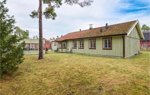 a house with a yard in front of it at Stunning Home In Romakloster With Kitchen in Romakloster