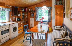 a kitchen with a table and chairs in a room at Cozy Home In Dals-rostock With Kitchen in Dals Rostock