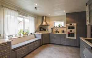 A kitchen or kitchenette at 4 Bedroom Beach Front Home In Dals Lnged