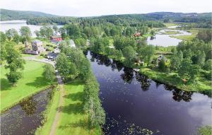 an aerial view of a river with a house and trees at 1 Bedroom Awesome Apartment In Saxn in Hällefors