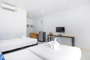 Un pat sau paturi într-o cameră la Srida Resort Lanna and Cafe