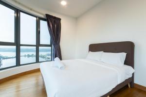 Postel nebo postele na pokoji v ubytování Teega Suites by RR JBcity