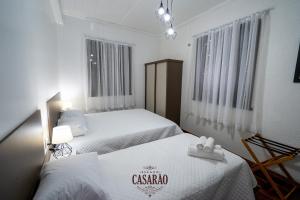 Tempat tidur dalam kamar di Espaço Casarão - Serra Gaúcha