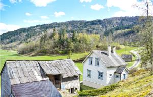 a white house on top of a hill at Beautiful Home In Norheimsund With 3 Bedrooms in Norheimsund