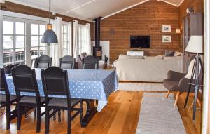 a living room with a table and chairs and a bed at Amazing Home In yer With Kitchen in Øyer