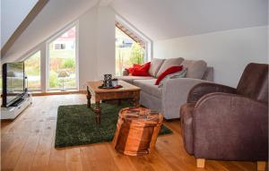 a living room with two couches and a tv at Beautiful Apartment In Geilo With Kitchen in Geilo