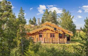 a log cabin in the woods with trees at Gorgeous Home In Lampeland With Kitchen in Lampeland