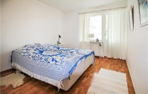 a white bedroom with a bed and a window at 1 Bedroom Stunning Home In Viken in Viken