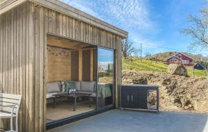 a wooden shed with a table and a bench at 4 Bedroom Gorgeous Home In Vanse in Vanse