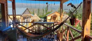 a hammock in a room with a view at Aires de Tafi in Tafí del Valle