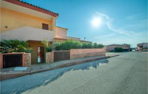 a house on a street next to a road at Bilo Sup in Isola Rossa