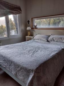 Кровать или кровати в номере Casa de montaña