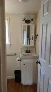 a bathroom with a sink and a mirror at The Nook in Dunlap