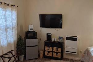 a living room with a flat screen tv on the wall at Cozy Cabin in Squaw Valley