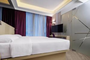 Krevet ili kreveti u jedinici u okviru objekta Starphire Hotel