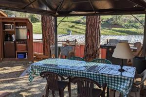 a table in a tent with a table cloth on it at The Apple Place Room #2 in Miramonte