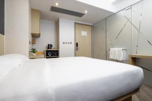 Krevet ili kreveti u jedinici u okviru objekta Starphire Hotel