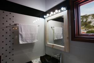 a bathroom with a sink and a mirror at Mistral-Patmos in Patmos