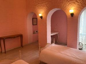 Postel nebo postele na pokoji v ubytování Rose Heritage Home