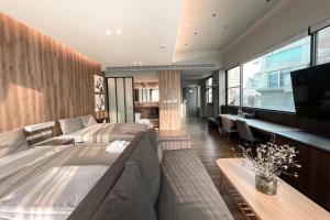 a bedroom with a large bed and a television at 台南圈旅 in Tainan