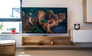 TV a/nebo společenská místnost v ubytování Lijon