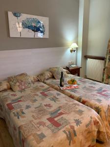 Postel nebo postele na pokoji v ubytování Hotel BONCOMPTE