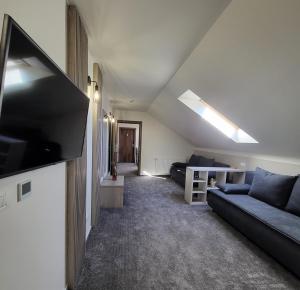 TV a/nebo společenská místnost v ubytování XO Residence