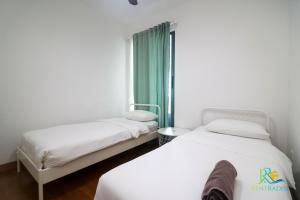 Postel nebo postele na pokoji v ubytování Teega Suites by RR JBcity