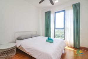 Postel nebo postele na pokoji v ubytování Teega Suites by RR JBcity