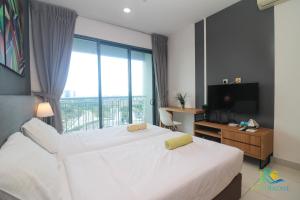 Postel nebo postele na pokoji v ubytování Teega Suites by RR JBcity