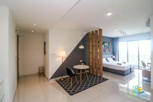 Postel nebo postele na pokoji v ubytování Teega Suites by RR JBcity