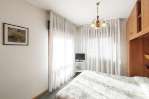 Postel nebo postele na pokoji v ubytování Albergo Belvedere