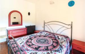 A bed or beds in a room at Amazing Apartment In Porto San Paolo