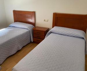 A bed or beds in a room at Isla de Tambo