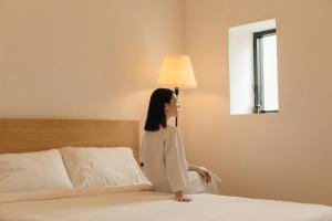 Hostel Urby tesisinde bir odada yatak veya yataklar