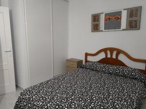 Łóżko lub łóżka w pokoju w obiekcie Vera Natura Apartamento Tony