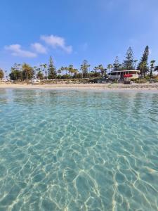 a view of a beach with crystal clear water at Nissi 3 Amazing Sea View Apartment in Ayia Napa