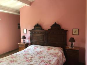 a bedroom with a bed and two night stands with lamps at Corte San Giuliano in Correzzola